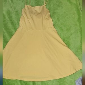 PLACE flowing/flared  spaghetti strap dress with tie back.